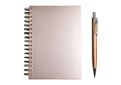 A spiral notebook and pen, both metallic and rose-gold hued, sit against a black background
