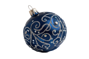 A solitary dark blue Christmas ornament with silver swirling patterns, isolated on black