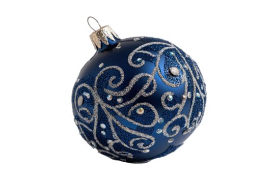 A solitary dark blue Christmas ornament with silver swirling patterns, isolated on black