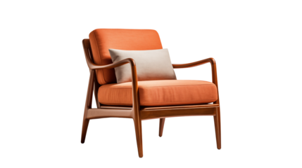 A cozy orange armchair with wooden frame and white pillow isolated on a black background studio shot