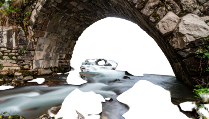 Stone bridge arches, with water cascading beneath
