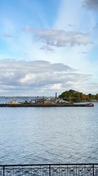 vertical screen barge mining sand dredger floating on river industrial scene extraction of natural resources water transportation and heavy machinery working process