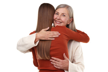 Mother and daughter hugging on white background