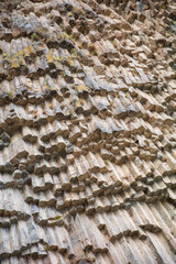 Close-up of stunning hexagonal basalt columns formed by volcanic lava cooling and fracturing into geometric shapes. The geology, nature, landscape, and earth science projects showcasing the natural