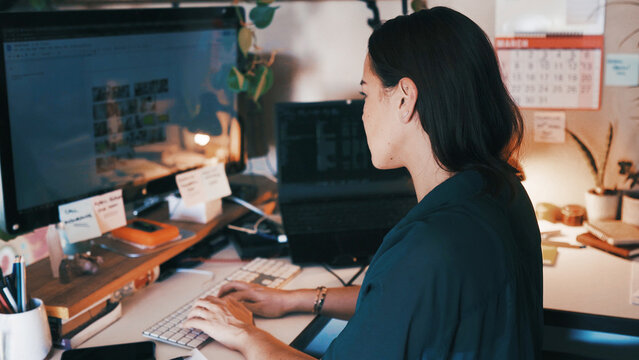 Remote work, editing and woman in home office with monitor, online research and review on brand design. Creative, WFH and graphic designer at desk with tech, digital and logo art analysis for project