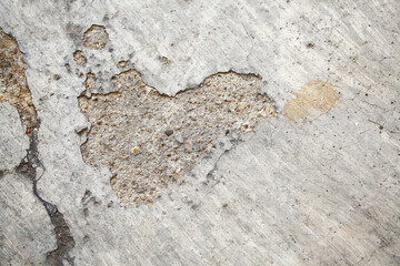 The textured cement of footpath with shape of heart,conceptual abstract background
