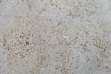 Abstract beige plaster background. Vintage pastel neutral background. Aged facade wall close-up. Textured background for website design layouts covers. Beautiful grunge pattern on the wall. Copy space