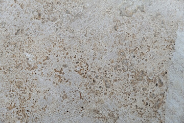 Abstract beige plaster background. Vintage pastel neutral background. Aged facade wall close-up. Textured background for website design layouts covers. Beautiful grunge pattern on the wall. Copy space