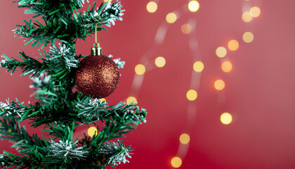 christmas tree banner and decorations with red bokeh background