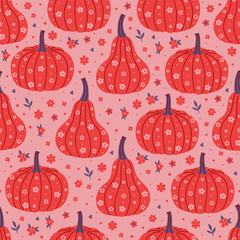 Seamless pattern with pumpkins and flowers. Vector graphics.