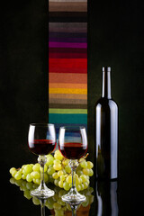 Still life with grapes and wine in glasses