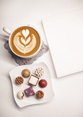 Latte art and gourmet chocolates.