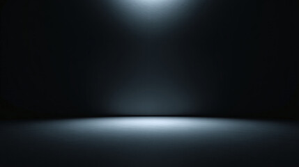 An empty dark room with a spotlight illuminating the floor. The image shows a dimly lit space with a strong contrast between light and shadow