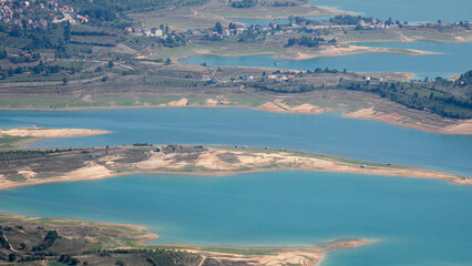 Expansive azure inlets snake through verdant countryside, perfect for World Wetlands Day reflections and picturesque nature reverie