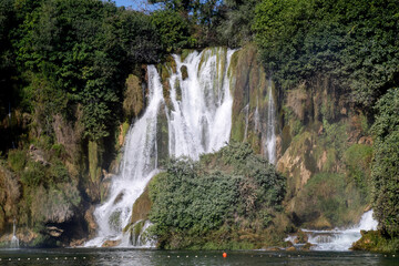 Cascading waterfall whispers secrets of natures symphony, Earth Day tranquility, hidden zen spa, lush verdant sanctuary, serendipity
