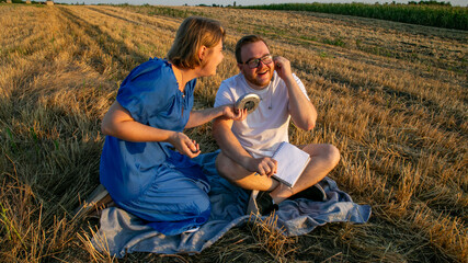 A lighthearted duo, Caucasian female and male, discover whimsical field crickets while celebrating quirky National Insect Appreciation Day