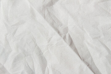 Wrinkled white paper texture background close-up