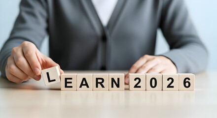 Obraz premium man Setting a Goal to Learn in 2026 with Wooden Blocks