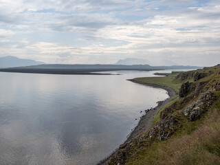island, shore and rocks on the seashore in iceland