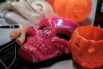 Halloween skull mask and pumpkin decorations, colorful spooky props and costume accessories for festive holiday celebration