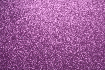 Abstract background. Shiny blurred purple glitter texture 