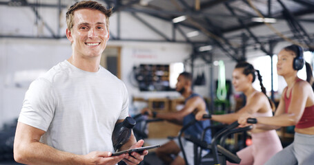 Portrait, man and tablet with people in spin class for fitness results, schedule session and progress. Coach, digital app and tracking of cycling exercise, training performance and workout management