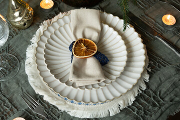Christmas dinner table setting. Winter themed table decor.