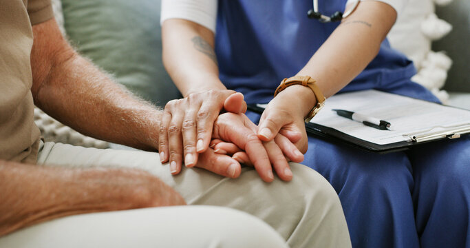 Clipboard, empathy and nurse holding hands with old person in clinic for consulting or support. Healthcare, rehabilitation or retirement with caregiver and senior patient in session for medical care