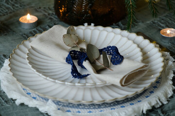 Christmas dinner table setting. Winter themed table decor.
