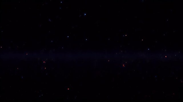 Dark expanse speckled with red & blue stellar lights resembling a deep cosmos view