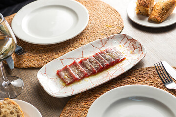 Elegant table in modern restaurant with tuna tataki