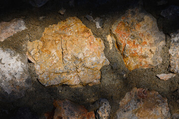 Rustic stone wall under bright sunlight