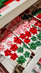 Colorful Christmas decorations including red, white, and blue ornaments, candy canes, and a red paper fan. Perfect for festive holiday settings.