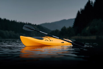 Bright yellow kayak with paddle floating on calm lake at dusk, adventure water sports in mountain landscape with dramatic dark sky