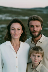 Fototapeta premium Warm outdoor family portrait of parents and child in soft evening light – close-up smiling mother, father and son, authentic connection and modern lifestyle