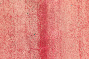 old red painted metal surface with peeling paint and rust texture, perfect for vintage or industrial background design