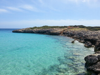 blue turquoise waters of coast bay in mondrago natural park in spain island of mallorcas