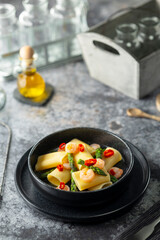 Calamarata pasta with shrimp, asparagus, and red chili