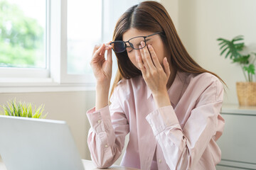 Eye problem concept, fatigue asian young woman tired eyes, irritated rubbing nose, relief vision...