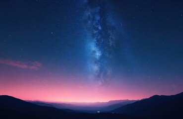 Fototapeta premium Milky Way galaxy in night sky over silhouetted mountains landscape. Stars shine brightly in dark blue and purple twilight sky. Pink and blue gradient on horizon. Peaceful and serene atmosphere.