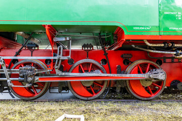 Detail of steam locomotive driving wheels and rods
