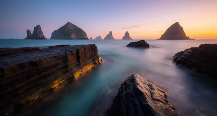 Coastal Sunrise Landscape with Rock Formations