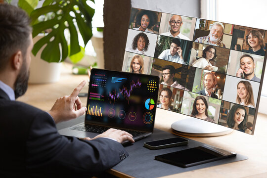 Businessman in virtual meeting presenting financial data charts with confident expression. Concept of business analytics, global communication, and hybrid workplace management. Bright poster