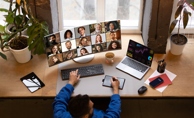 Manager leading remote conference analyzing statistics on curved widescreen monitor. Concept of...