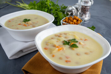 Two bowls of cheese soup with chickpeas. A diet rich in protein.