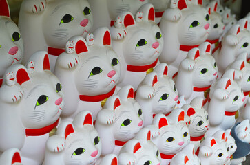 Rows of Maneki Neko Lucky Cat Figurines at Gotokuji Temple in Tokyo, Japan