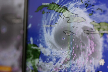 Fototapeta premium Hurricane Melissa shown on screen through windy app. Catastrophic storm towards Jamaica