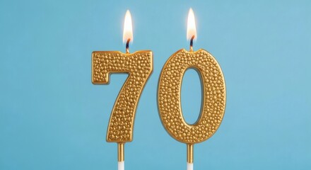 Golden 70 Seventy Years Celebration with Lit Candles on Blue.
