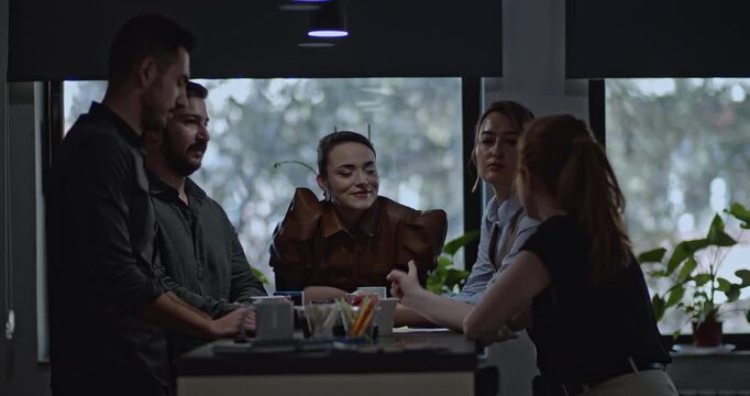 Students collaborate on a project, sharing ideas and insights in a dynamic learning environment. Teamwork and focused discussion foster problem-solving and knowledge exchange.