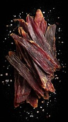 Charque (dried meat) from Bolivia on a salted black background, minimalist food photo, template for social media, digital ads, web banners, mobile wallpapers, greeting cards